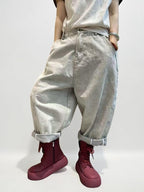 Light gray oversized harem jeans featuring a relaxed balloon silhouette.