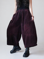 Oversized cropped corduroy pants in motion showing the relaxed fit.