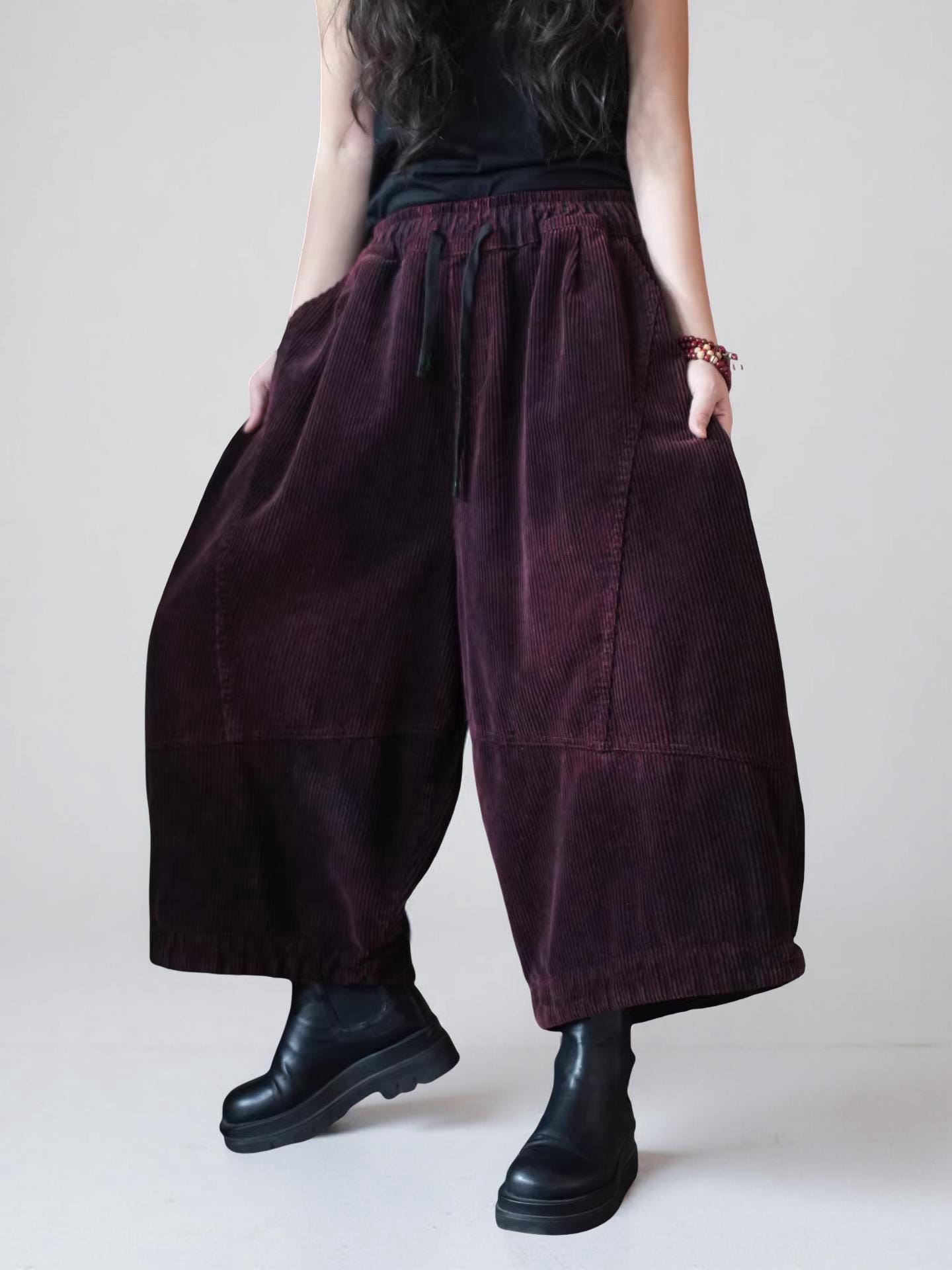 Oversized cropped corduroy pants in motion showing the relaxed fit.