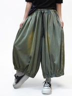 Oversized washed denim lantern pants front view