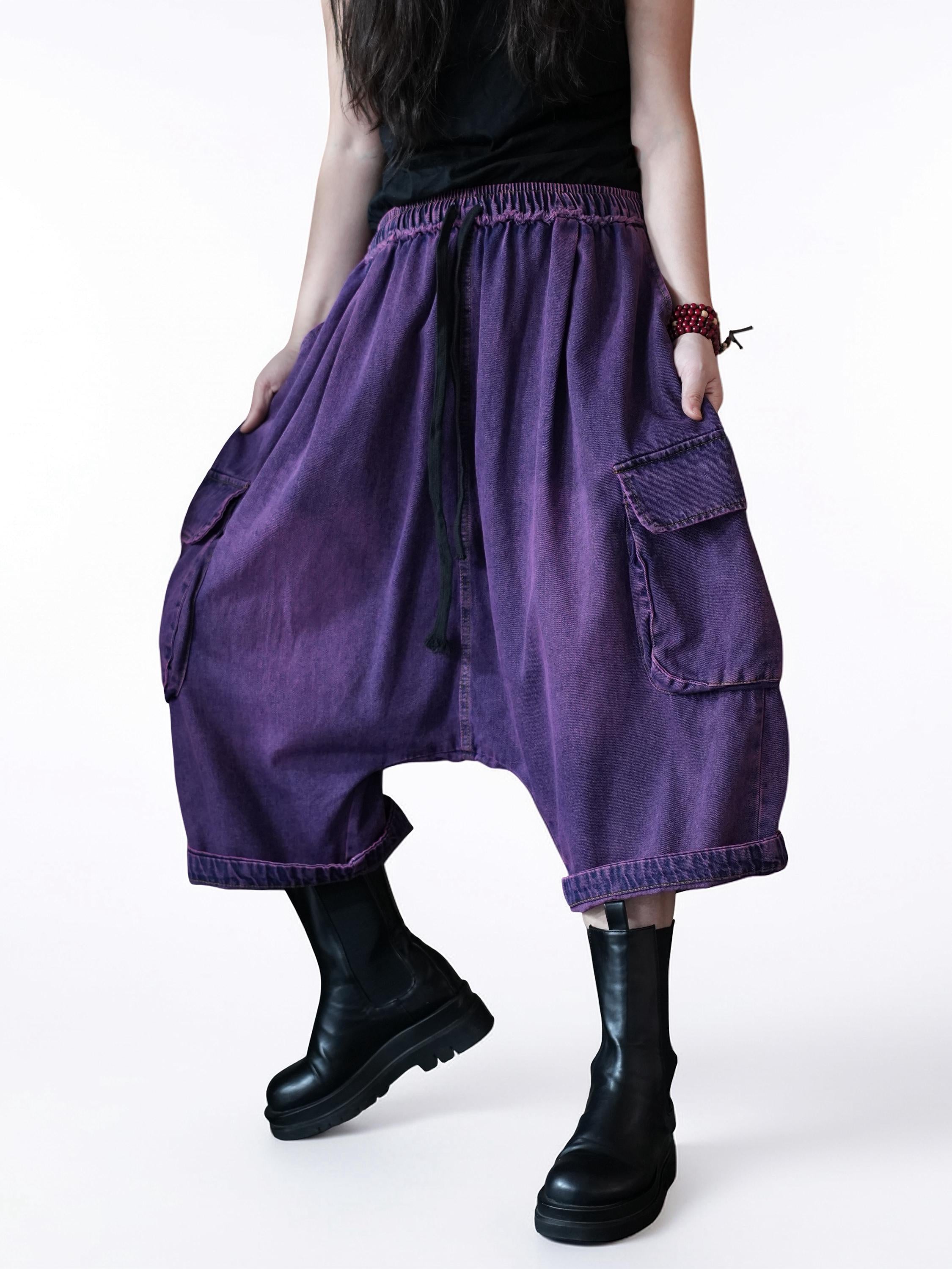 Purple vintage washed denim cargo harem pants with oversized drop-crotch silhouette.