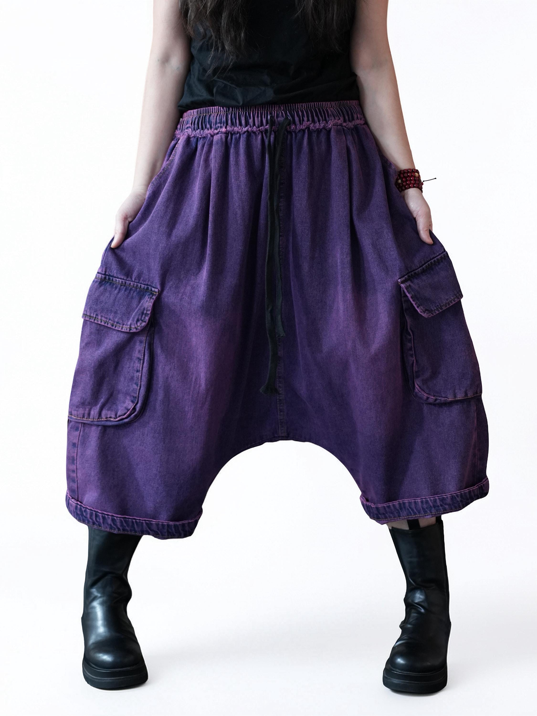 Front view of vintage washed denim cargo harem pants with oversized relaxed fit.