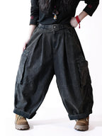 Oversized black workwear balloon pants with a high waist and cargo pockets.