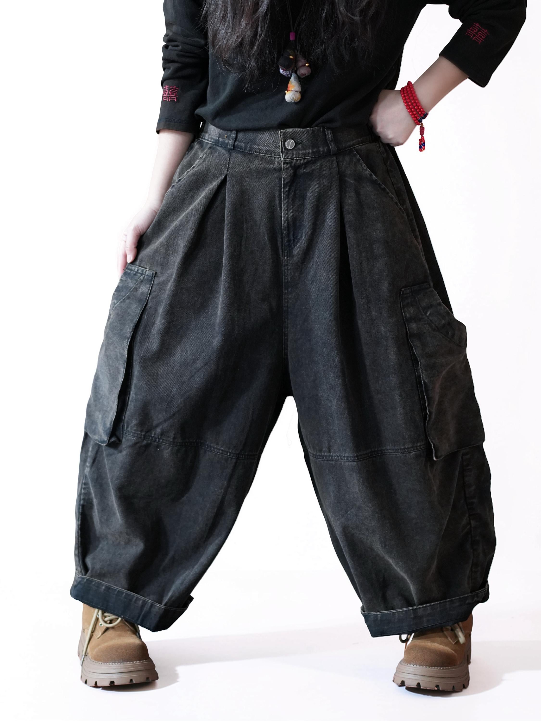 Oversized black workwear balloon pants with a high waist and cargo pockets.