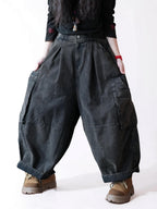 Side view of vintage washed black balloon cargo pants with a relaxed fit.