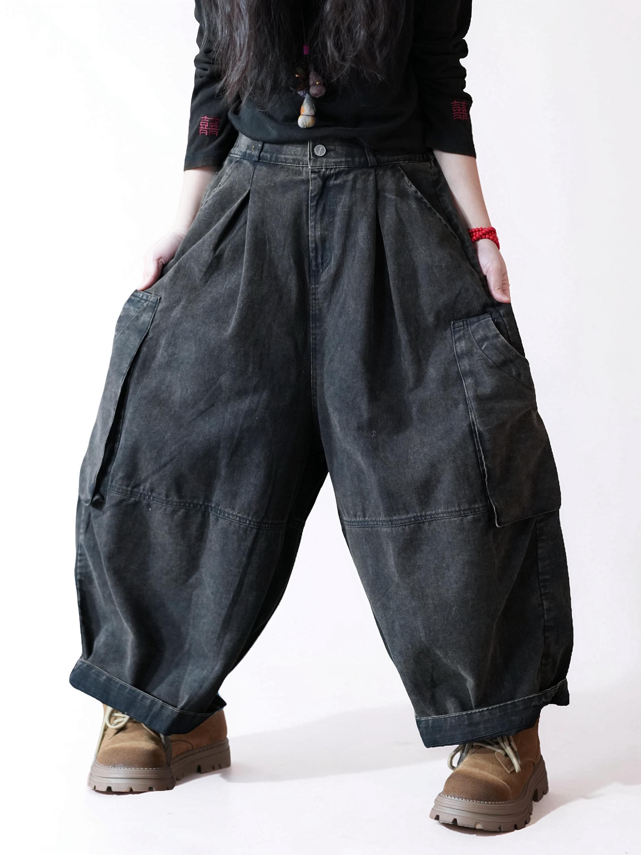 Side view of vintage washed black balloon cargo pants with a relaxed fit.