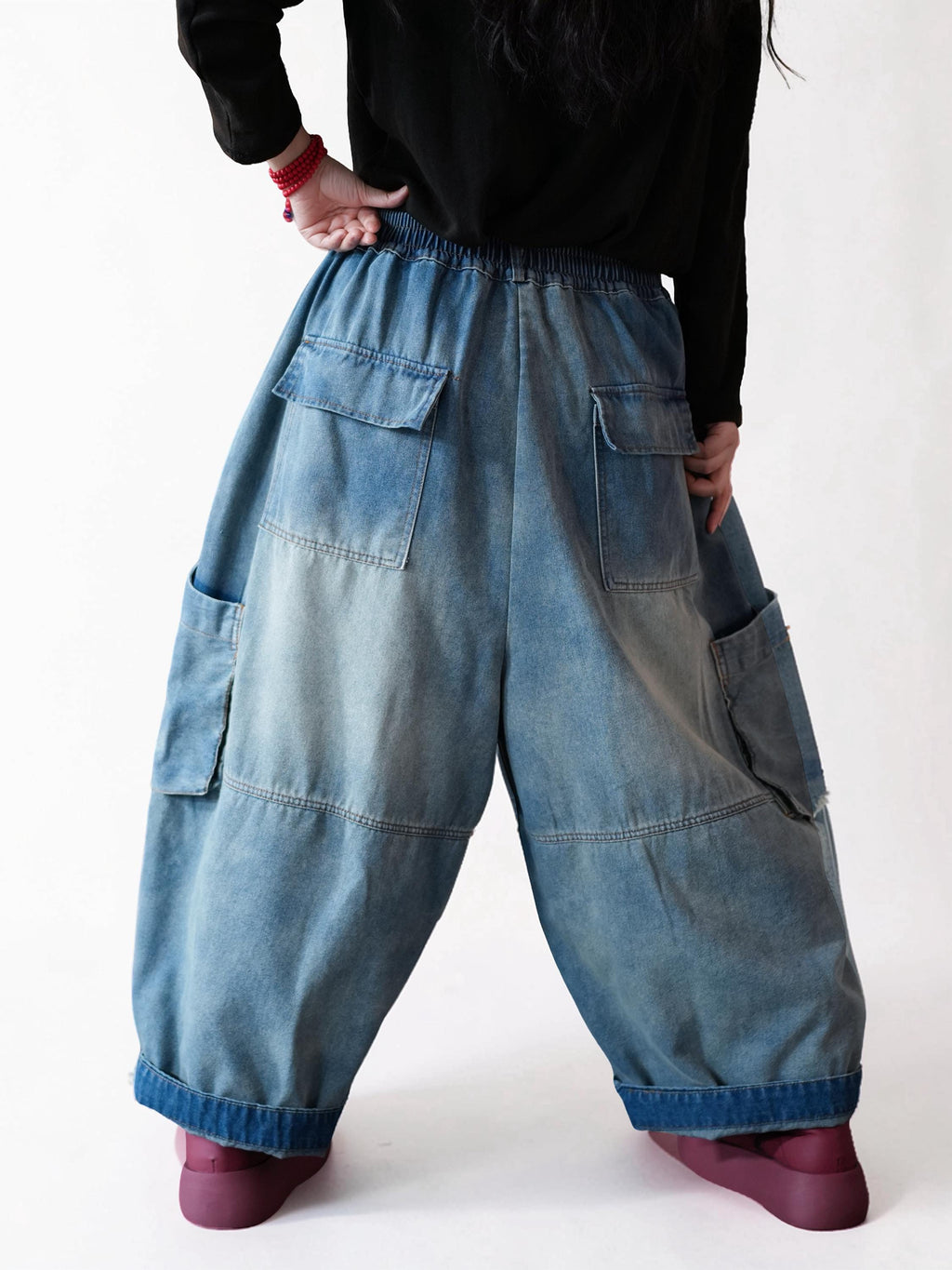 Back view of vintage washed blue balloon cargo jeans.