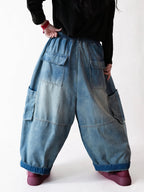Back view of vintage washed blue balloon cargo jeans.