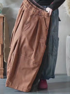 Model wearing vintage washed balloon workwear pants in motion.